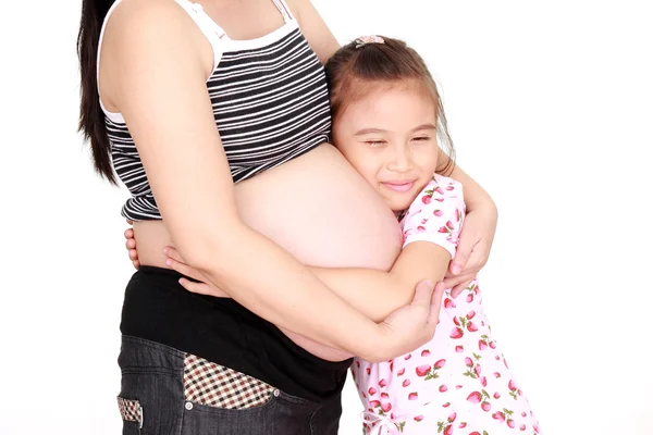 Belle femme enceinte et sa fille — Photo