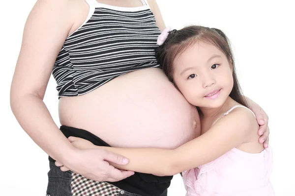 Beautiful pregnant woman and her daughter Stock Photo