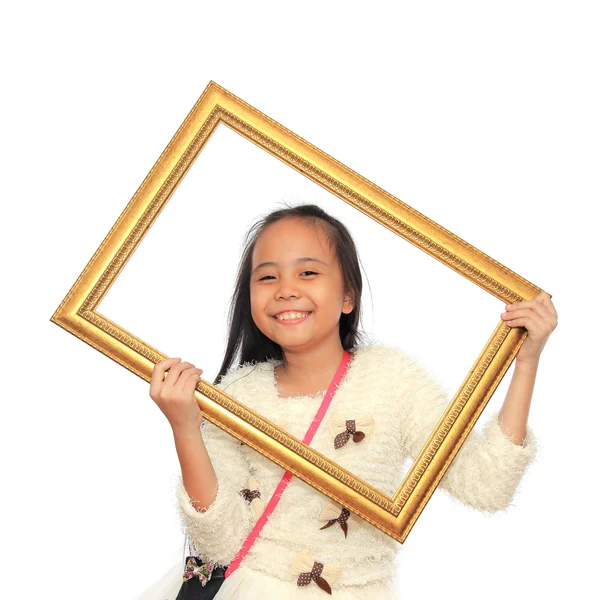 Menina feliz segurando uma moldura de imagem no fundo branco — Fotografia de Stock