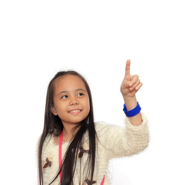 Sweet little asian girl pointing isolated on white background — Stock Photo, Image