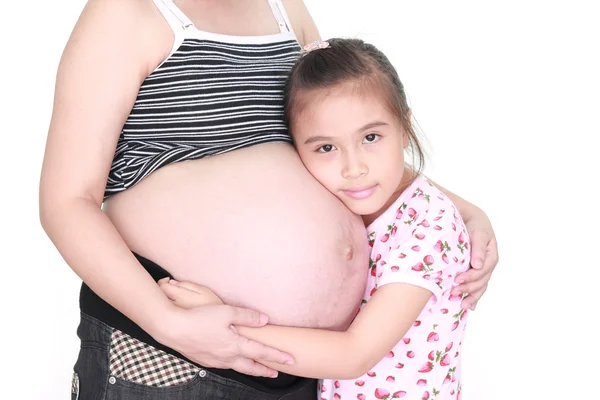 Pregnant woman and her daughter Stock Picture