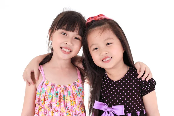 Duas meninas bonitas em um fundo branco — Fotografia de Stock
