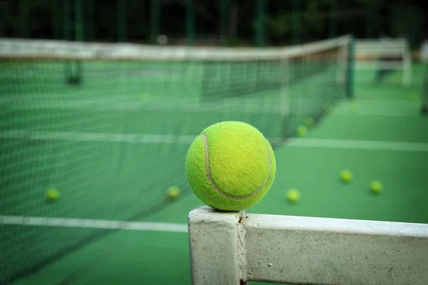 Tennis ball in net — Stock Photo, Image