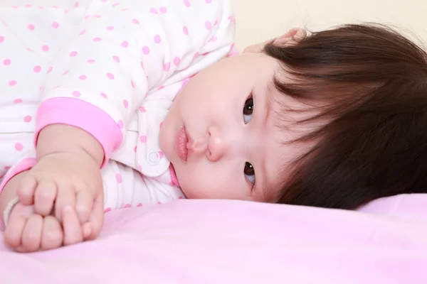 Baby girl on the bed — Stock Photo, Image