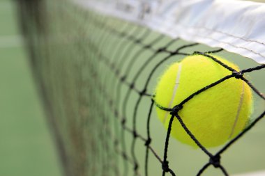 Tennis ball in net clipart