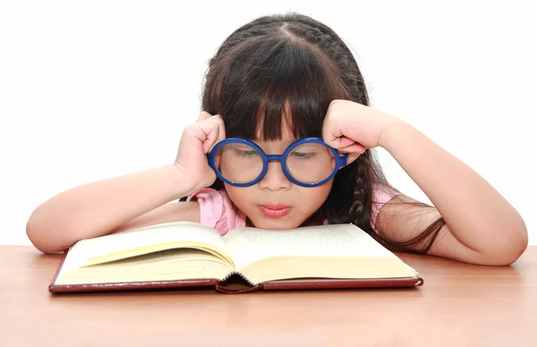 Asian little girl reading a book isolated on a over white backgr — Stock Photo, Image