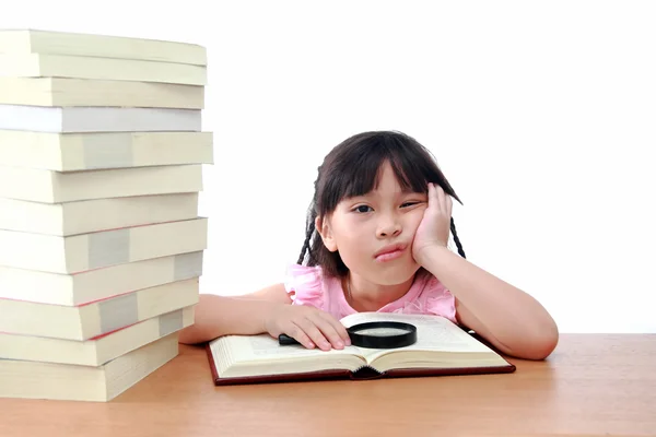 Beautiful little and serious asian girl reading book — Stock Photo, Image