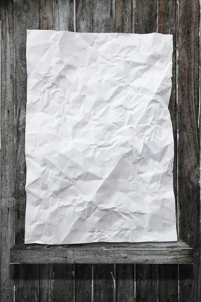 Crumpled white paper on wood shelf — Stock Photo, Image