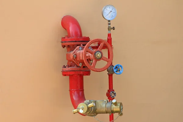 Fire hose on a wall — Stock Photo, Image