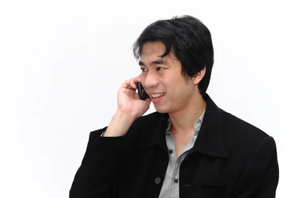 Šťastný podnikatel drží mobilní telefon pro komunikaci — Stock fotografie