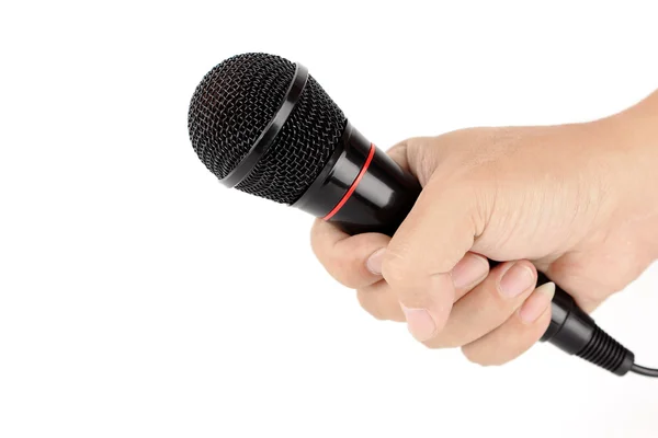 Hand holding black microphone — Stock Photo, Image