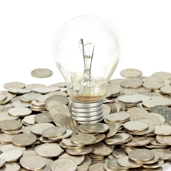 Lamp on coins — Stock Photo, Image