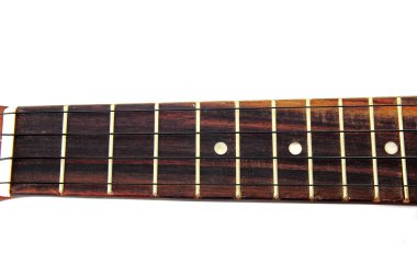 Vintage closeup ukulele on white isolated.