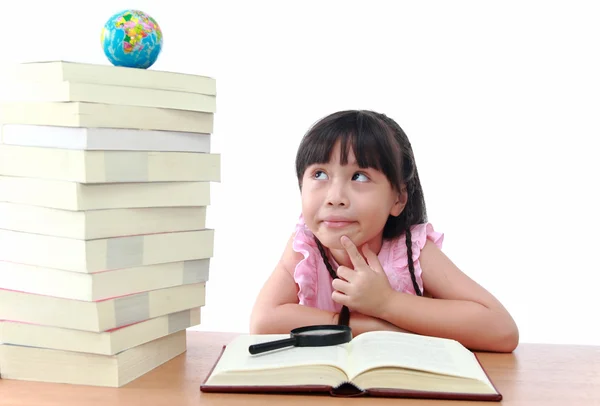 Student little girl reading with magnifying glass look the globe — Stock Photo, Image