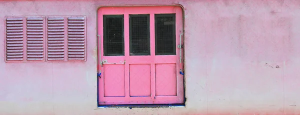 Pink grunge door and window — Stock Photo, Image