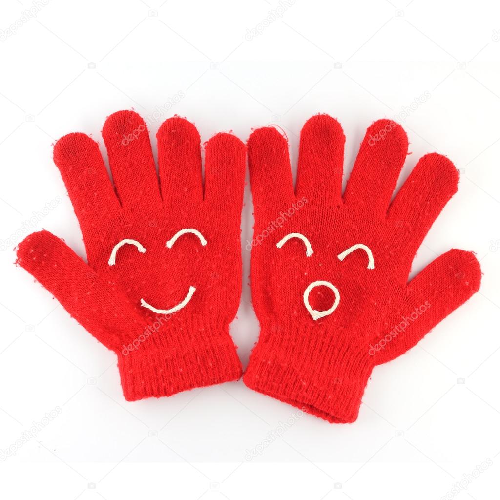 Pair of red winter gloves with happy face