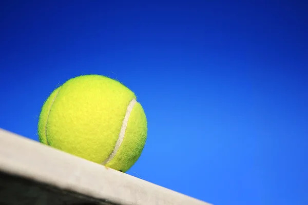 Tennis ball and blue sky — Stock Photo, Image