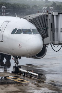 airplane at the airport in the rain