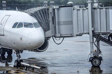 airplane at the airport in the rain