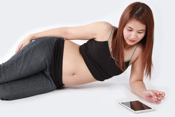 Beautiful Asian pregnant woman using tablet computer isolated wh — Stock Photo, Image