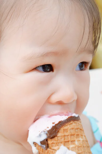 Little girl eating ice cream Stock Picture