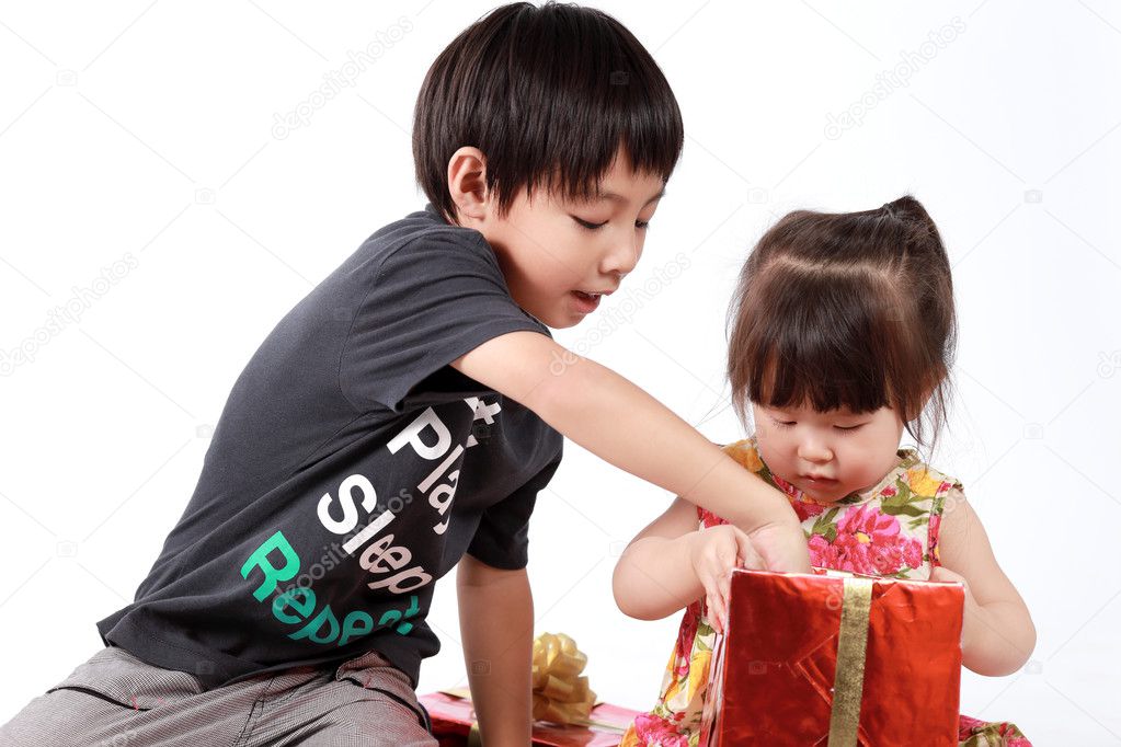 Brother and sister open gift box