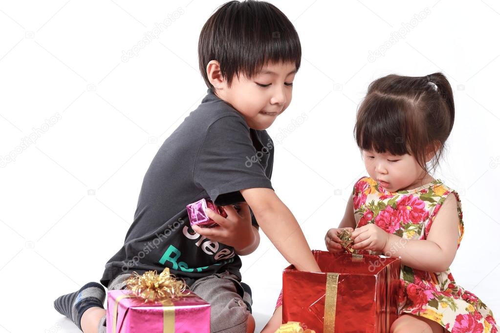 Brother and sister open gift box