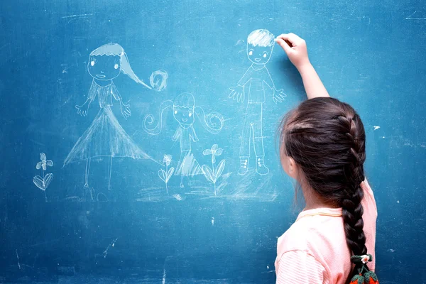 Girl drawing my family on chalkboard — Stock Photo, Image