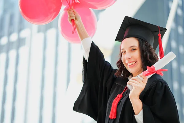 graduation day university woman and family, girl hold diploma and balloon congratulations on the graduation day.