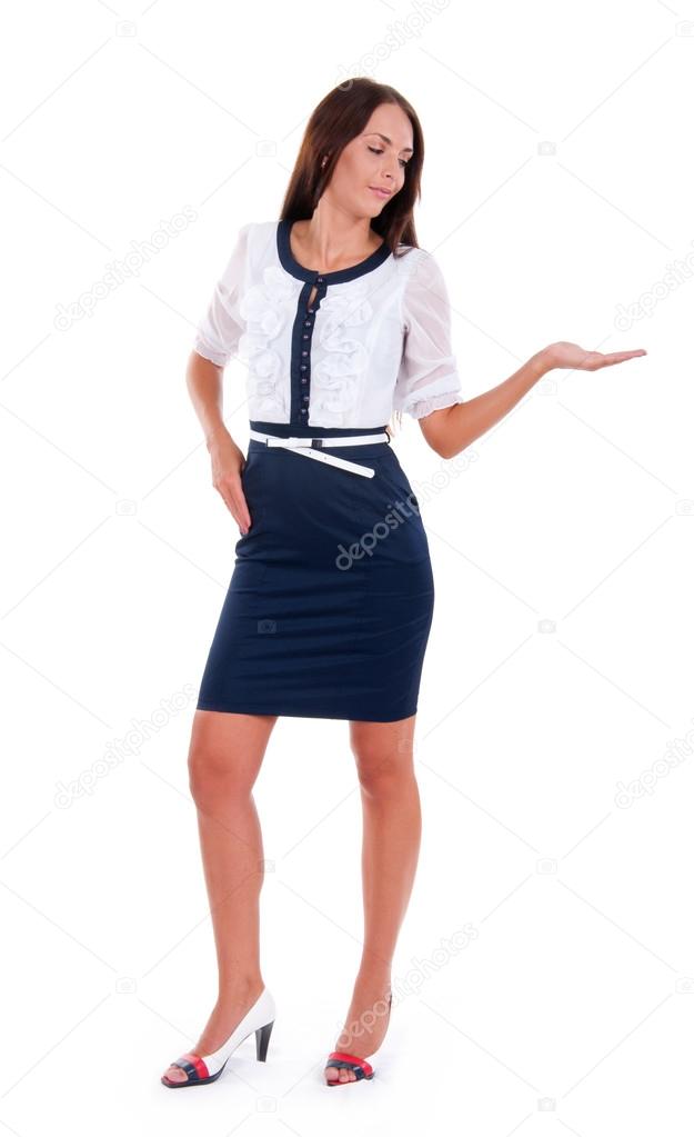 Business woman standing in full length isolated on white background and pointing at something