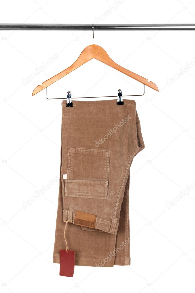 Trousers made of corduroys on hanger isolated on white