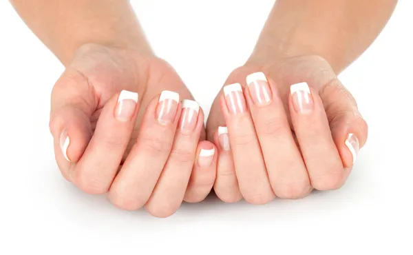 Belas mãos de mulher com manicure francês Imagem De Stock