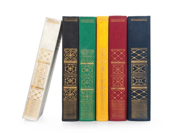 Beyaz arkaplanda bir yığın eski kitap