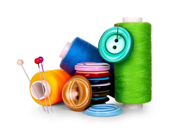 Buttons and skeins of thread on white background — Stock Photo, Image