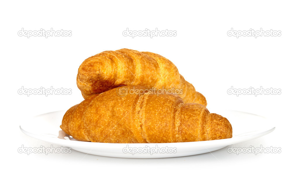 Appetizing croissants on plate isolated on white background