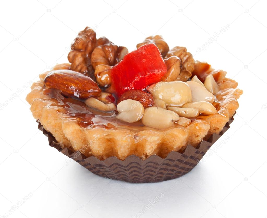 Cupcake with fruits and nuts isolated on white