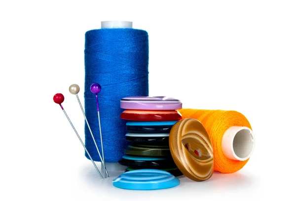 Buttons and skeins of thread on white background — Stock Photo, Image