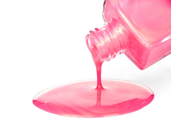 Pink nail polish on white background