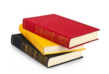 beyaz zemin üzerine eski yığılı renkli kitaplar