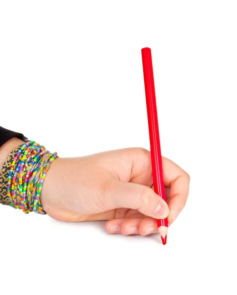 Red pencil in hand isolated on white background — Stock Photo, Image