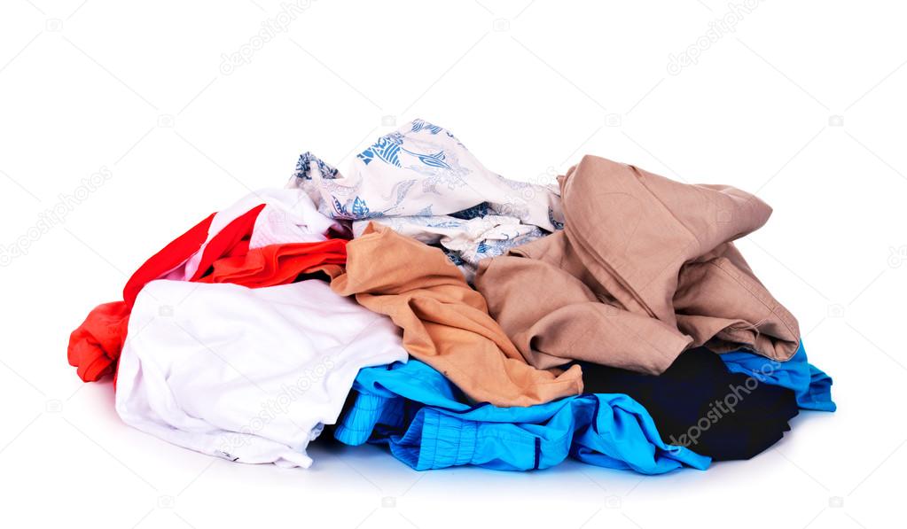 Big heap of colorful clothes, view from above, isolated on white background.