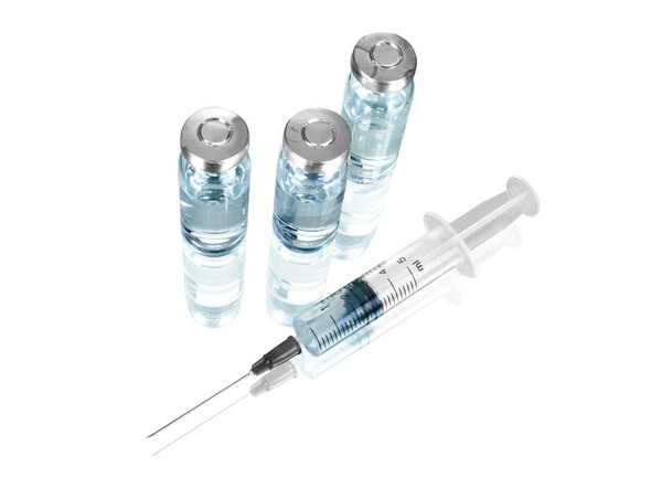 Medical ampoules and syringe isolated on white