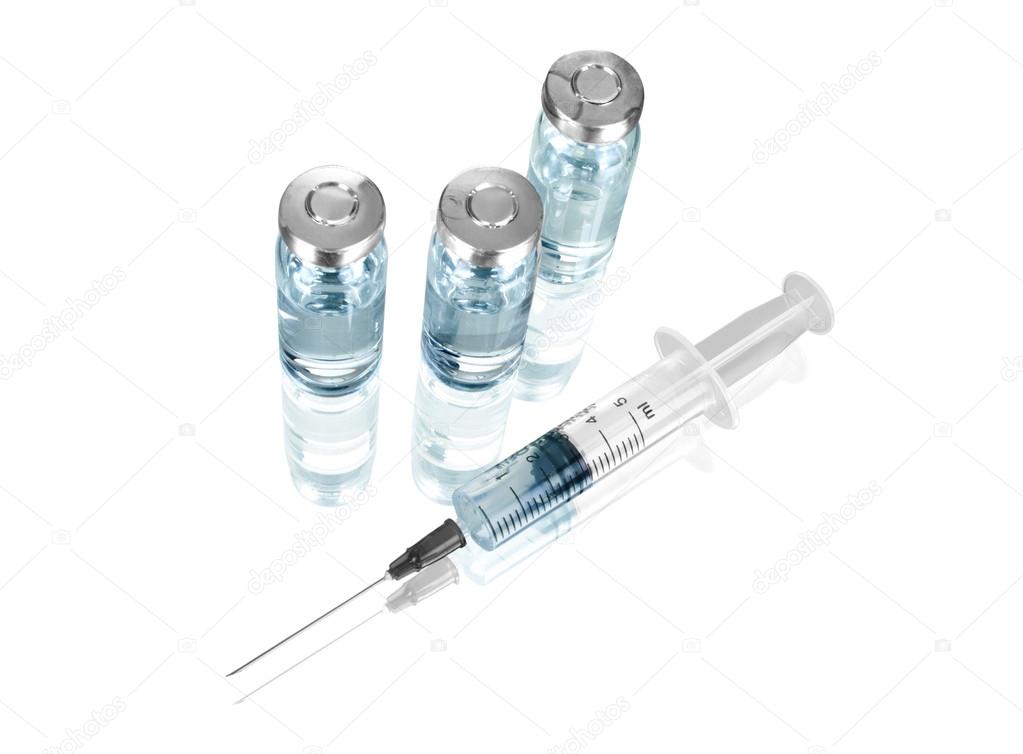 Medical ampoules and syringe isolated on white