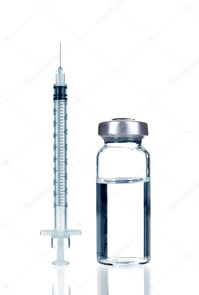 Medical ampoules and syringe isolated on white