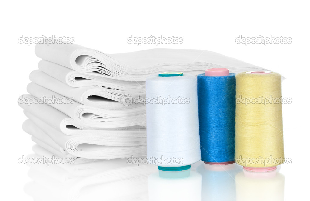 Fabric stack and thread on white background