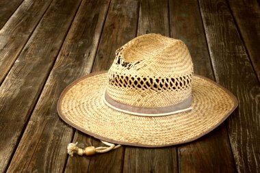 Wicker hat on wooden table
