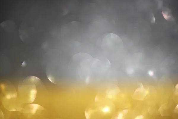 Gold and silver defocused glitter lights background. abstract bokeh. — Stock Photo, Image