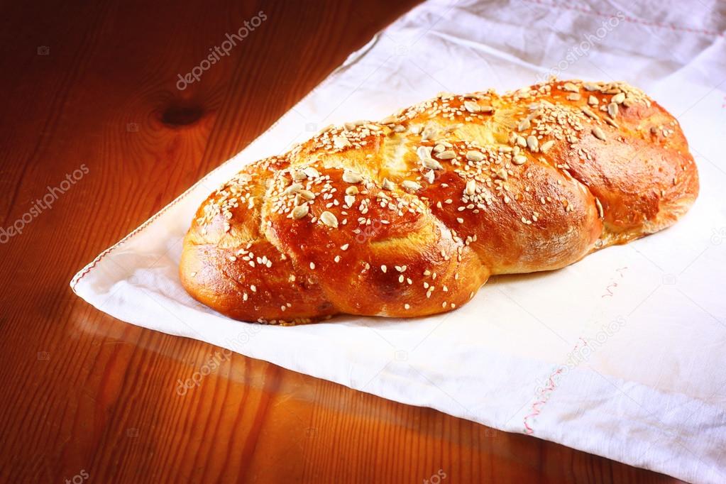 Challah bread on wooden table