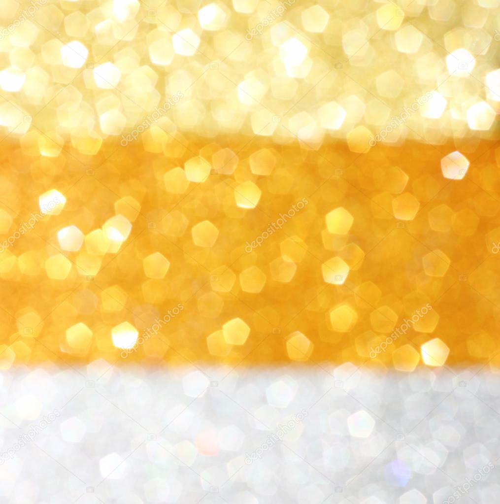 Gold and silver defocused glitter lights background. abstract bokeh.