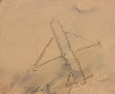 Deniz kumu, tatil veya tatil kavramı üzerinde çizilmiş uçak